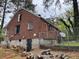 Brick exterior of home featuring fenced backyard and foundation wall at 3095 Rainbow Dr, Decatur, GA 30034