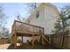 Enjoy outdoor living on this home's wooden backyard deck, perfect for entertaining and relaxing in a private setting at 3841 Admiral Dr, Atlanta, GA 30341