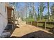 Fenced backyard featuring an elevated deck and staircase leading down to the yard at 3841 Admiral Dr, Atlanta, GA 30341