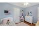 ' bedroom with white dresser, area rug, and playful accessories at 3841 Admiral Dr, Atlanta, GA 30341