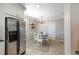 Cozy dining area features stainless steel refrigerator, white table set, and neutral decor at 3841 Admiral Dr, Atlanta, GA 30341