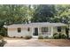 Charming single-story home featuring a welcoming front porch and well-maintained landscaping at 3841 Admiral Dr, Atlanta, GA 30341