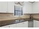 Modern kitchen features stainless steel appliances, granite countertops, and decorative backsplash at 3841 Admiral Dr, Atlanta, GA 30341