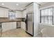 Modern kitchen with white cabinets, stainless steel appliances, and granite countertops at 3841 Admiral Dr, Atlanta, GA 30341