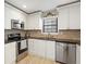 Updated kitchen featuring stainless steel appliances, sleek countertops, and stylish cabinetry at 3841 Admiral Dr, Atlanta, GA 30341