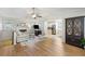 Open-concept living room with fireplace, hardwood flooring, and seamless flow to the adjacent kitchen at 3841 Admiral Dr, Atlanta, GA 30341