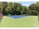 Community tennis courts offer a vibrant playing surface and mature surrounding trees at 3841 Admiral Dr, Atlanta, GA 30341