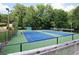 Community tennis courts with mature surrounding trees and shaded benches at 3841 Admiral Dr, Atlanta, GA 30341