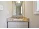 Bathroom vanity featuring granite countertops and modern fixtures at 93 Carriage Lake Dr, Stockbridge, GA 30281