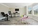 Living room, featuring light hardwood flooring and bay windows at 93 Carriage Lake Dr, Stockbridge, GA 30281