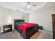 Main bedroom featuring a trey ceiling, neutral walls, and a ceiling fan at 93 Carriage Lake Dr, Stockbridge, GA 30281