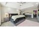 Well-lit main bedroom with tray ceiling, contemporary decor, and ample space for relaxation and personalization at 93 Carriage Lake Dr, Stockbridge, GA 30281