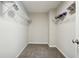 Spacious walk-in closet with carpeted floors and white wire shelving for optimal storage and organization at 93 Carriage Lake Dr, Stockbridge, GA 30281