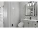 Stylish bathroom featuring marble tile, sleek vanity and sliding glass door at 3521 Kittery Dr, Snellville, GA 30039