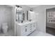 Bathroom featuring double vanity, modern fixtures, and marble tile floors at 3521 Kittery Dr, Snellville, GA 30039