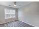 Cozy bedroom featuring ceiling fan, hardwood floors and natural light at 3521 Kittery Dr, Snellville, GA 30039