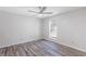 This is a well-lit room with a ceiling fan and modern vinyl floors at 3521 Kittery Dr, Snellville, GA 30039