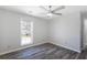 This is a well-lit room with a ceiling fan and modern vinyl floors at 3521 Kittery Dr, Snellville, GA 30039