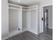 Walk-in closet with custom shelving and storage, plus wood-look flooring at 3521 Kittery Dr, Snellville, GA 30039