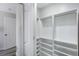 White closet shelving and closet rod provides ample storage space at 3521 Kittery Dr, Snellville, GA 30039