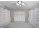 Spacious closet features white built-in shelving, cabinets and marble floors at 3521 Kittery Dr, Snellville, GA 30039