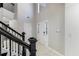 Bright foyer featuring soaring ceilings, black iron staircase, and marble flooring at 3521 Kittery Dr, Snellville, GA 30039