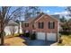 Charming brick home with two-car garage and landscaped front yard at 3521 Kittery Dr, Snellville, GA 30039