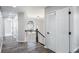 Upstairs hallway featuring dark floors, white doors and trim, and pendant lighting at 3521 Kittery Dr, Snellville, GA 30039