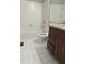 Bathroom with tiled shower-tub, toilet, and vanity with granite countertop and dark wood, providing a modern touch at 3958 Wolcott Cir, Doraville, GA 30340