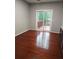 Dining area showcasing hardwood floors, a sliding glass door to the deck, and neutral paint, providing a modern touch at 3958 Wolcott Cir, Doraville, GA 30340