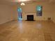 Living room with tile floors, a fireplace, and a window with natural light streaming in at 3958 Wolcott Cir, Doraville, GA 30340