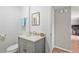 Bright bathroom with a marble vanity, modern sink and faucet, gray cabinets, and light colored walls at 566 Trillum Sw Ct, Marietta, GA 30008