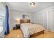 Cozy bedroom with hardwood floors, natural light, closet space, and neutral paint at 566 Trillum Sw Ct, Marietta, GA 30008