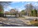 Gated community entrance with decorative wrought iron gates and stone pillars, enhancing security at 566 Trillum Sw Ct, Marietta, GA 30008