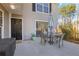 Cozy patio featuring a dining set, sliding glass door, and access to the home's entry at 566 Trillum Sw Ct, Marietta, GA 30008