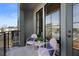 Outdoor balcony with a pair of lounge chairs and an exterior view of neighborhood at 989 Bibbs Circle Nw, Atlanta, GA 30318