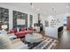 Bright living room featuring stylish furniture, a decorative wall, and an open layout into the kitchen at 989 Bibbs Circle Nw, Atlanta, GA 30318