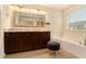 Bright bathroom with double sink vanity, soaking tub, and neutral tile at , Atlanta, GA 30318