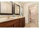 Bathroom with a double vanity, framed mirrors, and tiled floors at , Atlanta, GA 30318