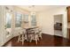 Cozy breakfast nook featuring a modern light fixture, ample natural light, and stylish barstool seating for casual dining at , Atlanta, GA 30318