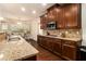 Contemporary kitchen with granite countertops, stainless steel appliances, and warm wood cabinetry, creating a chef-friendly space at , Atlanta, GA 30318