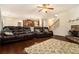 Bright living room with hardwood floors, area rug, fireplace and open staircase at , Atlanta, GA 30318