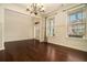 Bright living area featuring hardwood floors, large windows, and decorative molding, perfect for entertaining and relaxation at , Atlanta, GA 30318