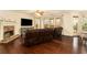 Spacious living room featuring hardwood floors, a cozy stone fireplace, and sliding glass doors to a private outdoor space at , Atlanta, GA 30318