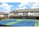 Community tennis courts with well-maintained surface, surrounded by townhomes in a residential neighborhood at , Atlanta, GA 30318