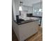 Stylish kitchen featuring sleek black granite countertops, elegant white cabinets, and modern stainless steel appliances at 234 Carlyle Park Ne Dr # 234, Atlanta, GA 30307