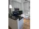 Stylish kitchen with white cabinets, granite countertops, stainless microwave, and an undermount range at 234 Carlyle Park Ne Dr # 234, Atlanta, GA 30307