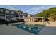 Community pool with lounge area, clubhouse, and well-maintained landscaping, perfect for relaxation and recreation at 234 Carlyle Park Ne Dr # 234, Atlanta, GA 30307