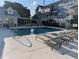 Community pool with lounge chairs, inviting residents to unwind and soak up the sun in a serene setting at 234 Carlyle Park Ne Dr # 234, Atlanta, GA 30307