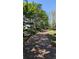 Brick walkway through the community lined with trees, benches, and manicured landscaping at 234 Carlyle Park Ne Dr # 234, Atlanta, GA 30307